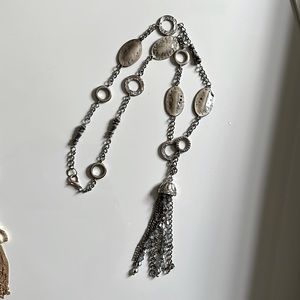 WHITE HOUSE BLACK MARKET SILVER toned tassel pendant.